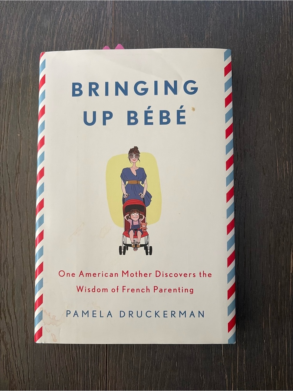 Bringing Up Bébé by Pamela Druckerman - White Cover with Red & Blue Accents